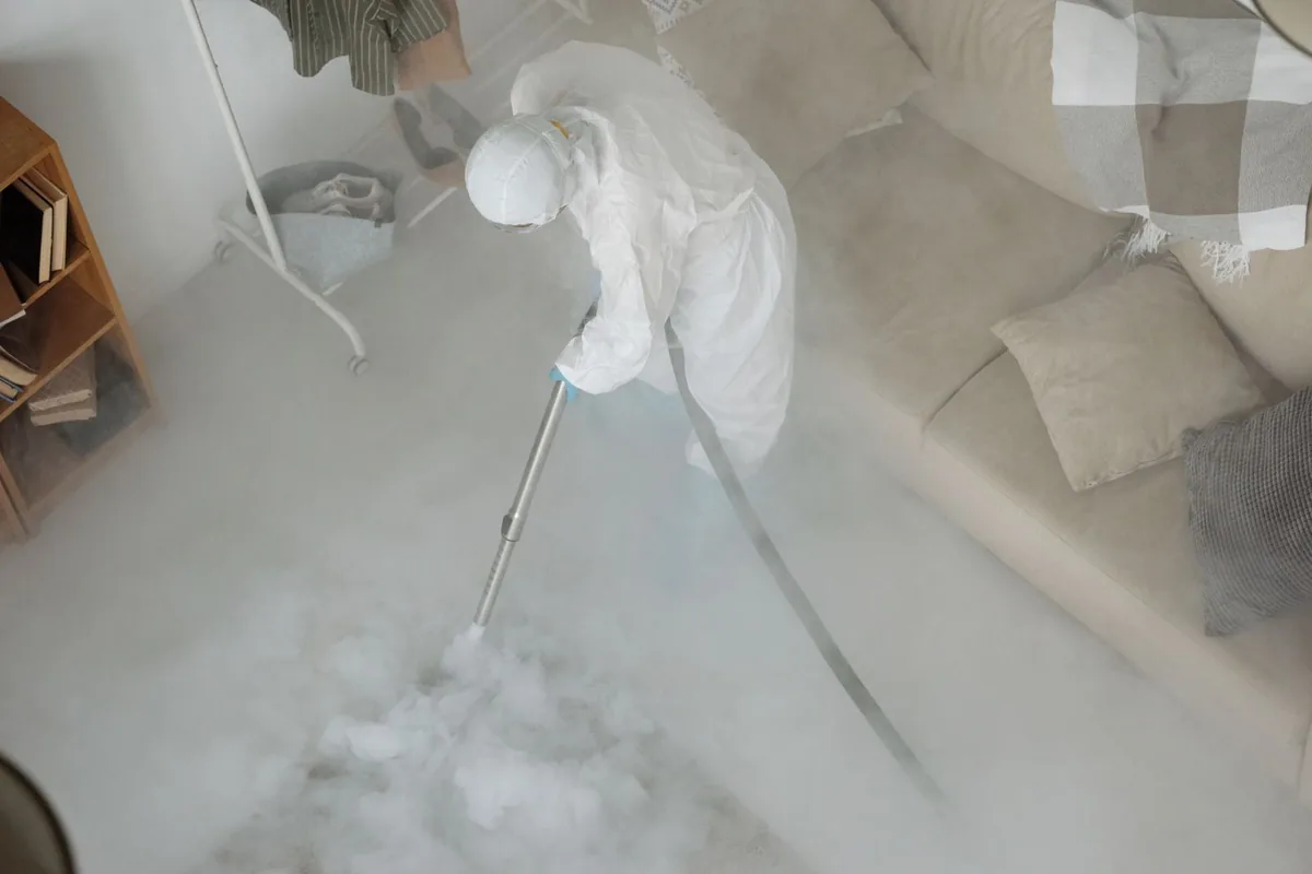Biohazard cleanup technician in protective equipment, Manheim Park, Kansas City, MO